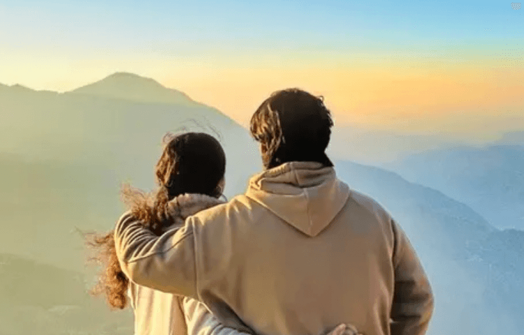 Couple looking at mountain view Couple looking at mountain view